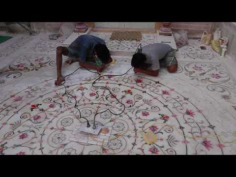 Beautiful inlay  work in whitemarble floor