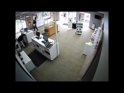 Surveillance video: Armed robbery at cell phone store (1of2)