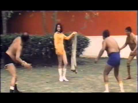 Cleopatra Wong (Marrie Lee) is fighting against 3 professional wrestlers