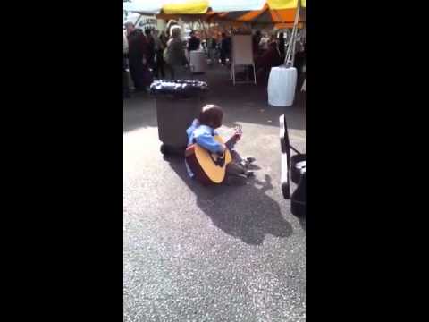 Kid plays guitar at farmers market(Insanely good)