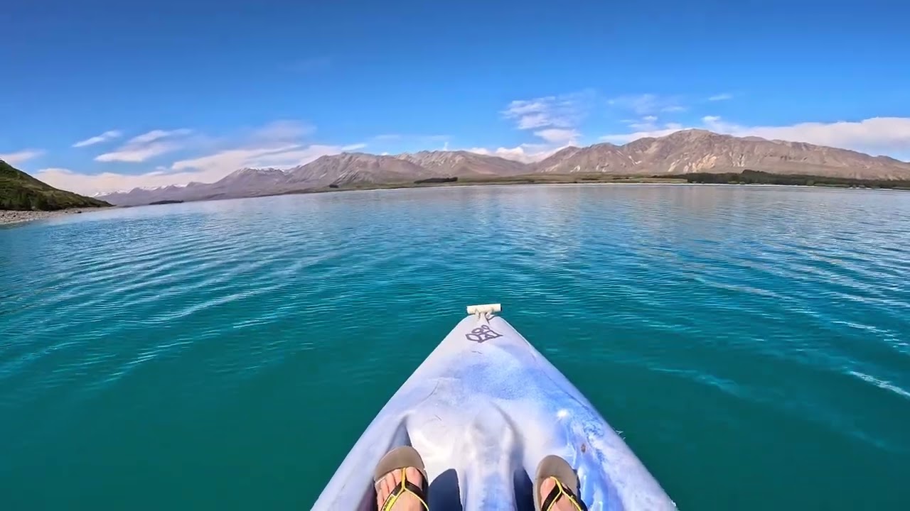 Explore Lake Tekapo’s turquoise waters by kayak with alpine scenery.