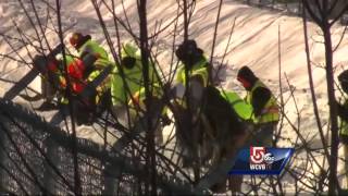 Day laborers, inmates work to dig out Red Line rails