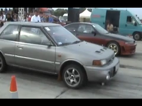 Thumbnail for Nissan Skyline GTS Vs. Mazda 323 Turbo 4X4 Drag Race by Mazda, Nissan