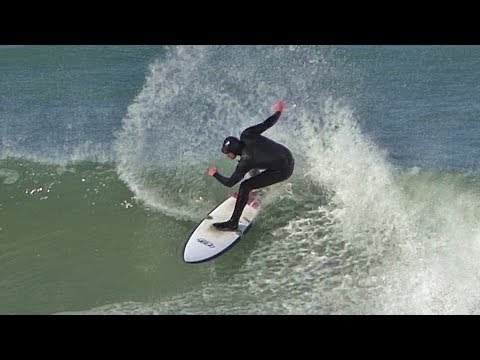 Waves and surfers at Portreath