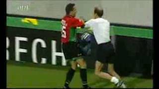 Football fan saves the game,,,but get some beef afterwards...