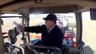 driving Case Quadtrac tractor with Auto Steer gps in a field