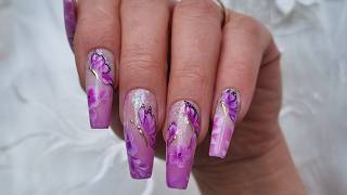 Glitter fade, ombre buterflys, and flower nail art. Purple nails