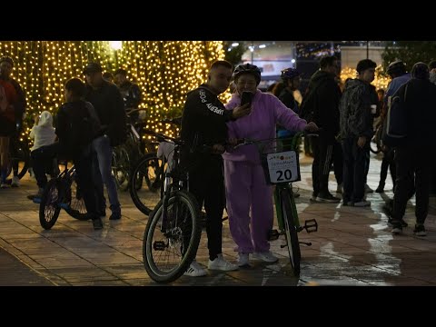 Video | Bogota's bikes wheel through the city for annual festive night cycle | AFP