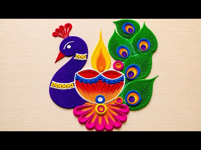 Small peacock rangoli design by pallavi vinod