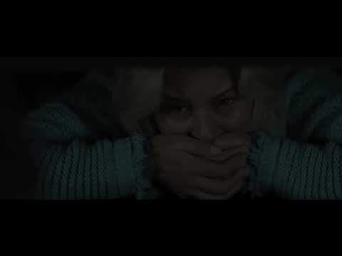 Trailer frame: the barn at night with ominous red glyphs