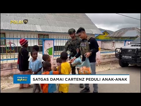 PERSONEL OPS DAMAI CARTENZ BAGIKAN PAKET SEMBAKO KEPADA WARGA DAN ANAK-ANAK