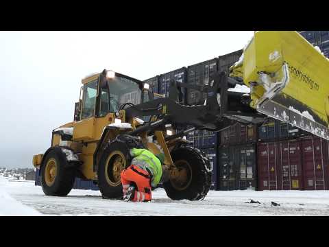 Volvo loader getting the snow chains one.