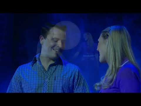 UK tour promo still for The Witches of Eastwick musical, teasing Darryl Van Horne’s arrival in Eastwick