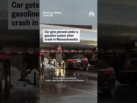 Car gets pinned under a gasoline tanker after crash in Massachusetts