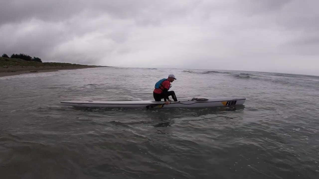 Off the beach ocean surf ski start.