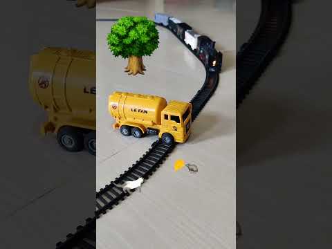 Oil tanker truck is stuck near the railway track and frieght train is approaching fast | Rail King