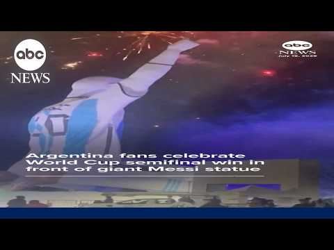 Argentina fans celebrate win over England in front of big Messi statue