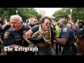 US riot police clash with pro-Palestine protesters on college campuses