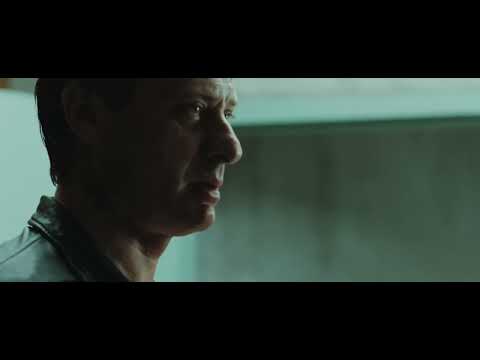 Trailer frame: Mikael drives through snow as a dark ostinato sets the pace