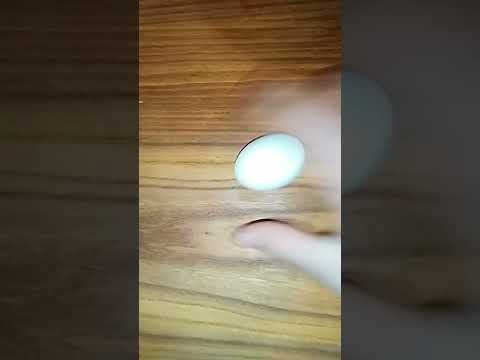 How to tell the difference between a hard boiled and raw egg