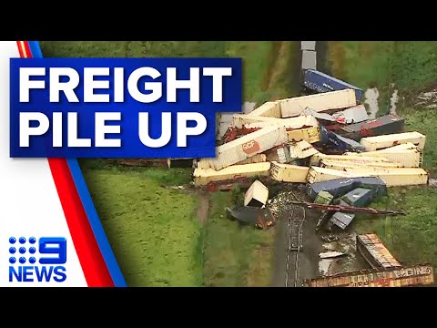 Freight train derails, causes tens of carriages piled up on tracks | 9 News Australia