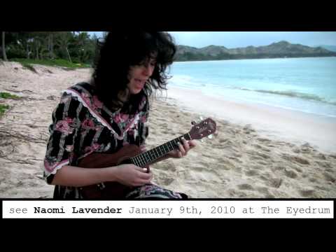 Naomi Lavender sings on the beach.