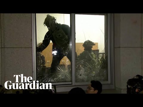 South Korean soldiers enter parliament through smashed windows