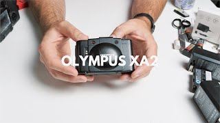 How to USE an OLYMPUS XA2 Rangefinder 35mm Film Camera - BATTERY Replacement & REVIEW