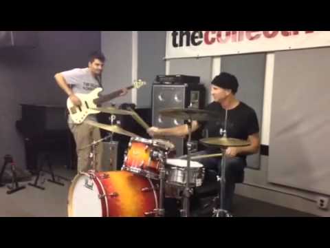 Chad Smith jamming with bass student.