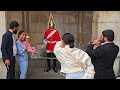 IMPATIENT TOURIST PUSHES IN AFTER ONE GROUP MONOPOLISE the King's Guard at Horse Guards!