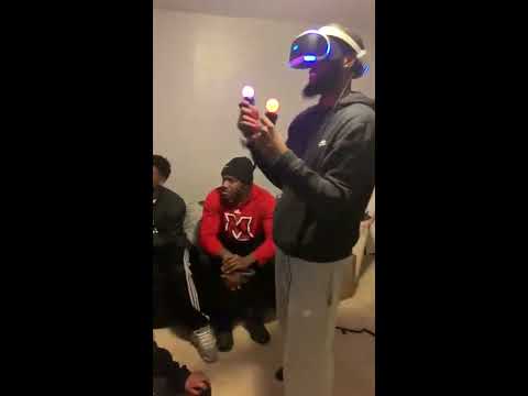 Guy playing VR Boxing knocks out Friend watching