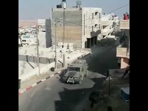 Palestinian youth confront the Israeli occupation forces that raided Tuqu' village, near Bethlehem