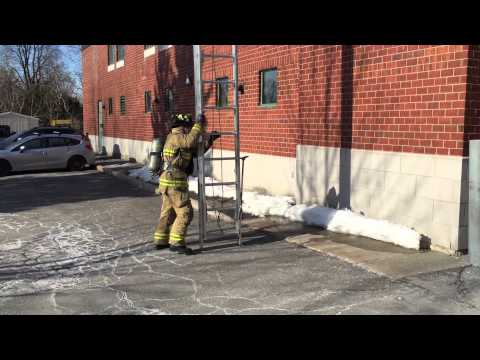 High shoulder carry and throw of a 28ft ladder