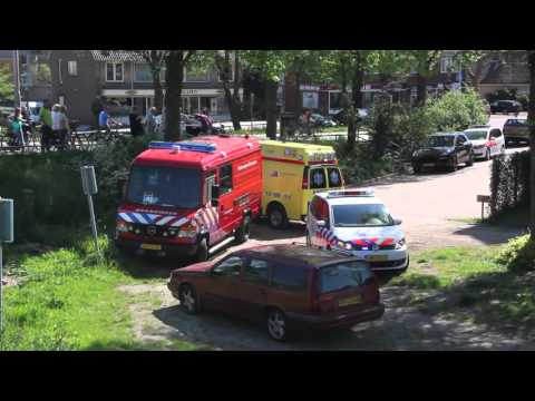 Man bekneld in luik in Ouderkerk a/d Amstel