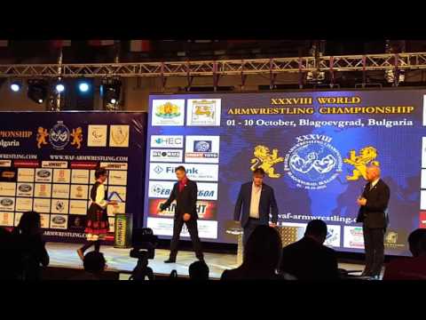 The president of world armwrestling federation awards Pantelis Filikidis.