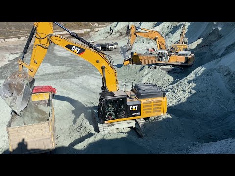 Caterpillar 352F - Caterpillar 385C And Liebherr 974 Excavators Loading Trucks