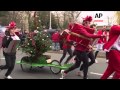NEW Thousands Of Santas Race Through Streets Of Paris