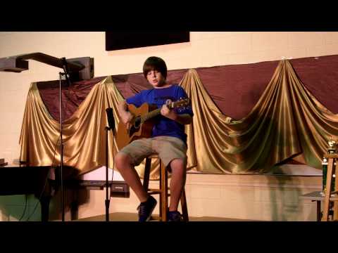 "Three Little Birds" performed by Tyson Curtis