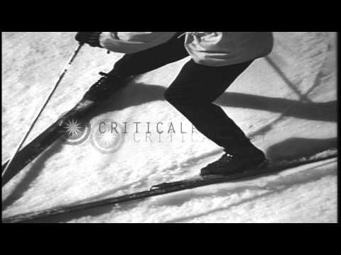 Men demonstrate the method and technique of the snow plow turn in a snow covered ...HD Stock Footage