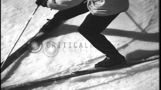 Men demonstrate the method and technique of the snow plow turn in a snow covered ...HD Stock Footage