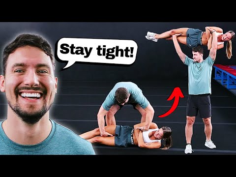 Elite cheerleaders try strongman skills