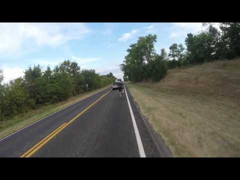 Cyclists have close call with vehicle.  Nearly hit by mirror.
