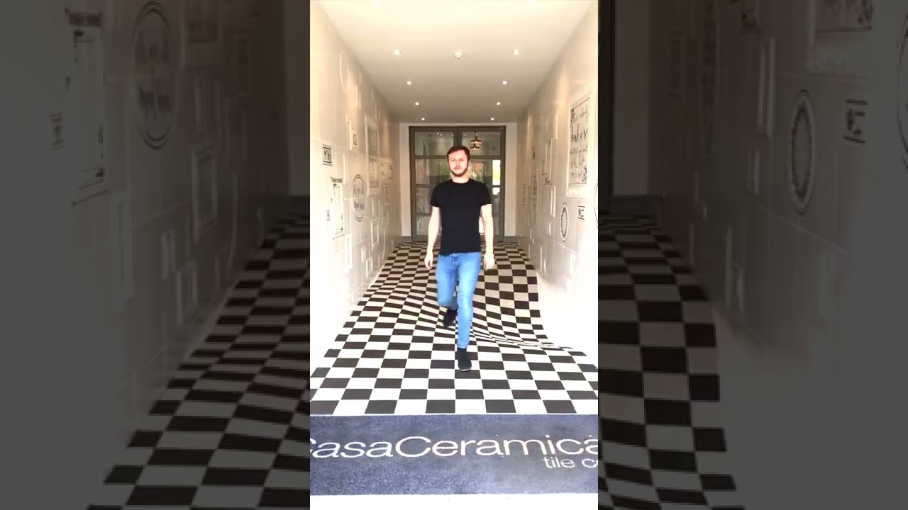 Watch video Office hallway with a tile floor illusion #shorts Now Office hallway with a tile floor illusion #shorts