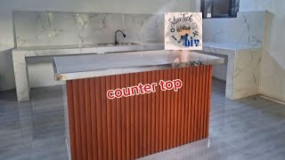 Build a newest aura counter top Center island granite w/PVC wall cladding