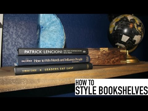 Part of a video titled How To Style Bookshelves For A Man | Rustic Industrial | Office Decor