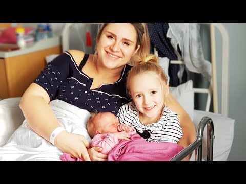 Little girl meets her newborn baby sister for the first time