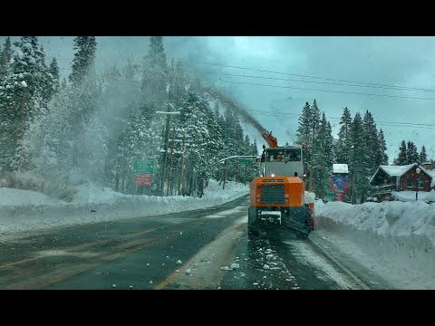 Snow removal underway after an early season snowstorm in Sierra Nevadas at Soda Springs CA