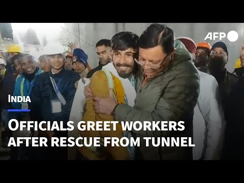 Indian official greets workers after rescue from tunnel | AFP