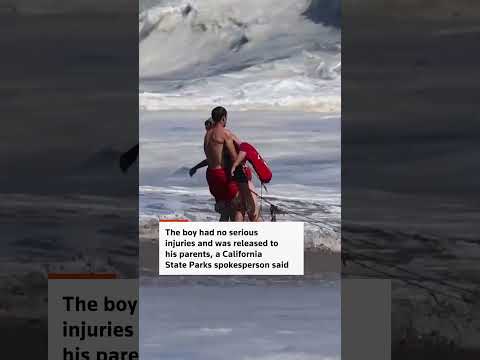Video Thumbnail: Lifeguard rescues young boy from powerful waves on California beach