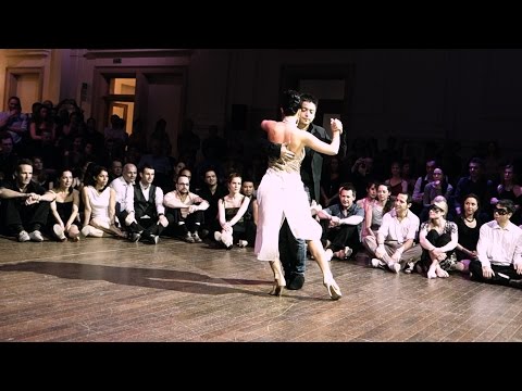  Carlos Espinoza  and  Valeria Maside  are  dancing  to  the  tango  "  Fantasía en tiempo de tango  "  by  Osmar Maderna  at  Brussels Tango Festival  in  2015